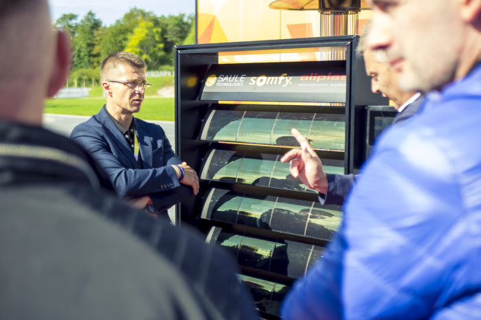 People discussing around the solar sunblinds demonstrator
