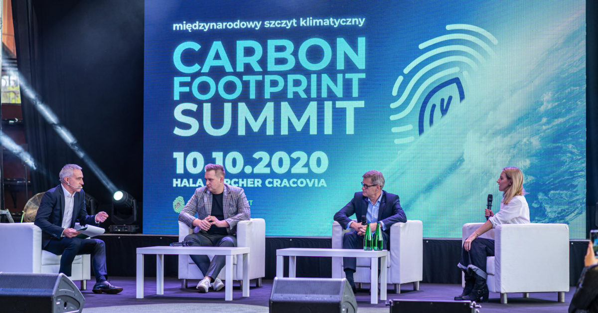 Olga Malinkiewicz in the debate, on the stage with 3 other participants